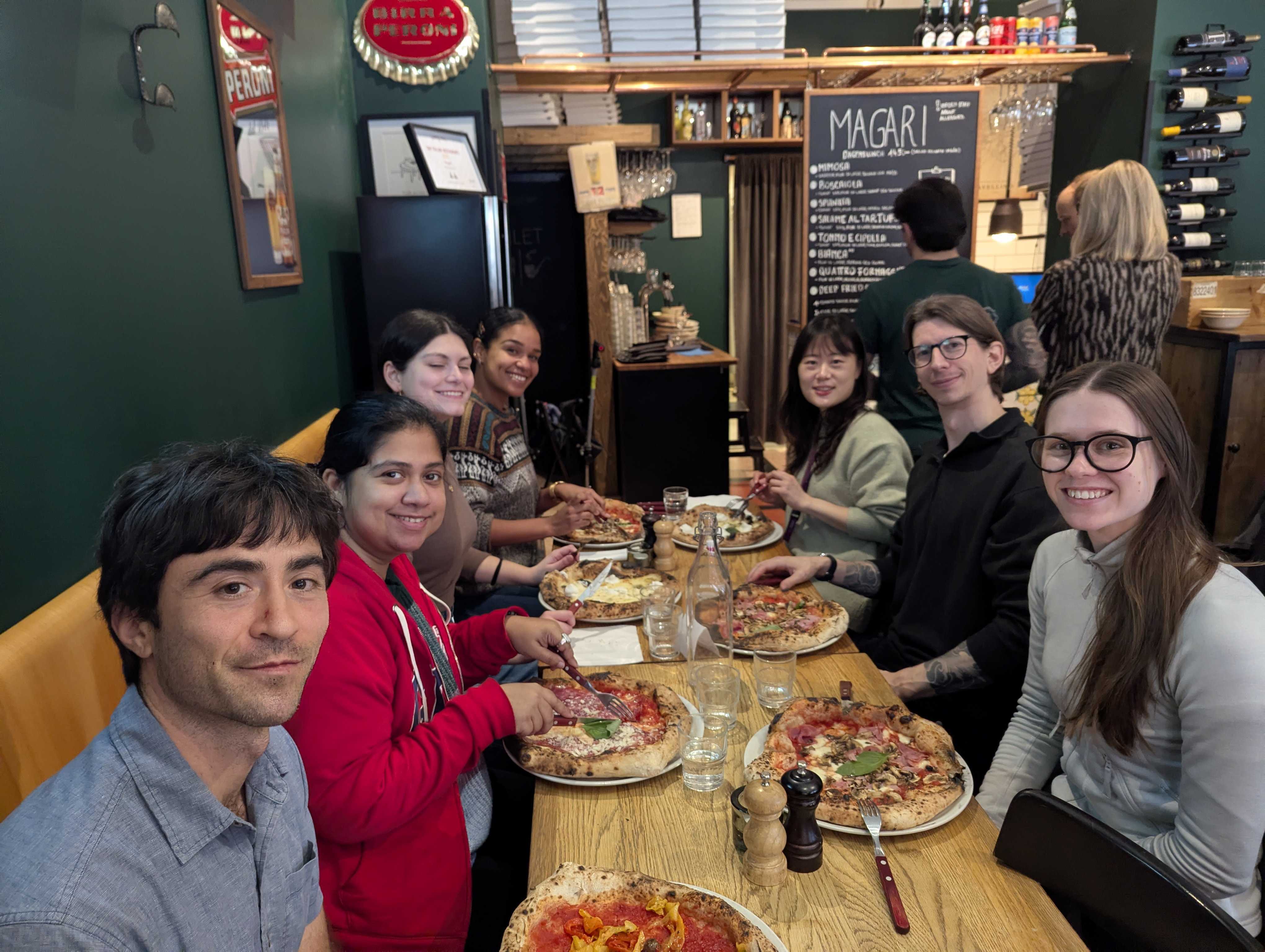 Members of the Fossati Lab at a lab dinner